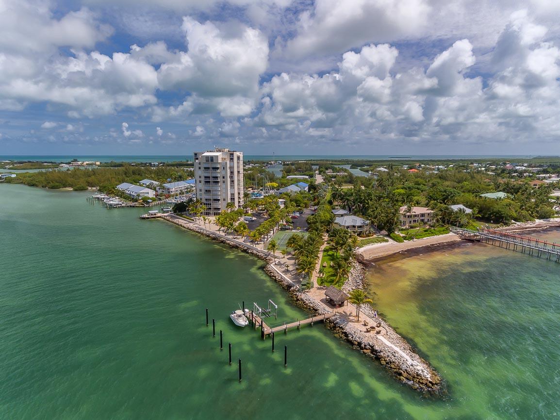 2000 Coco Plum Drive, Unit 404 Marathon, FL 33050 - Photo 22 of 23 a view of a lake with a city