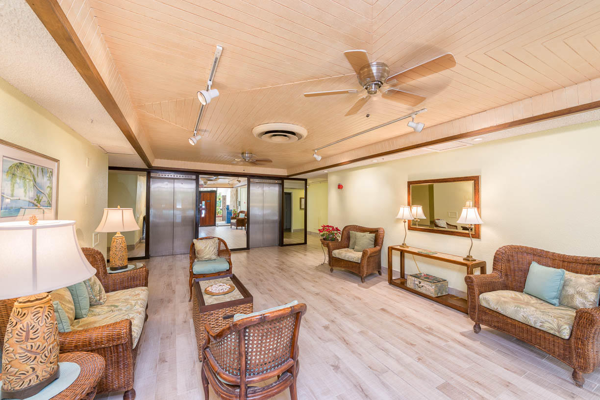 2000 Coco Plum Drive, Unit 404 Marathon, FL 33050 - Photo 3 of 23 a living room with furniture and a large window