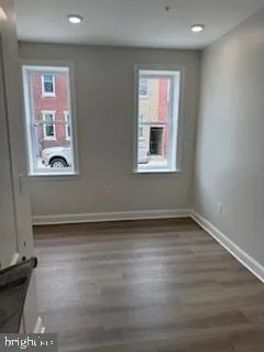 a bathroom with a shower a mirror and a sink