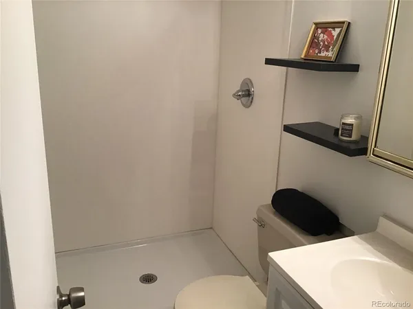 a bathroom with a toilet and a sink
