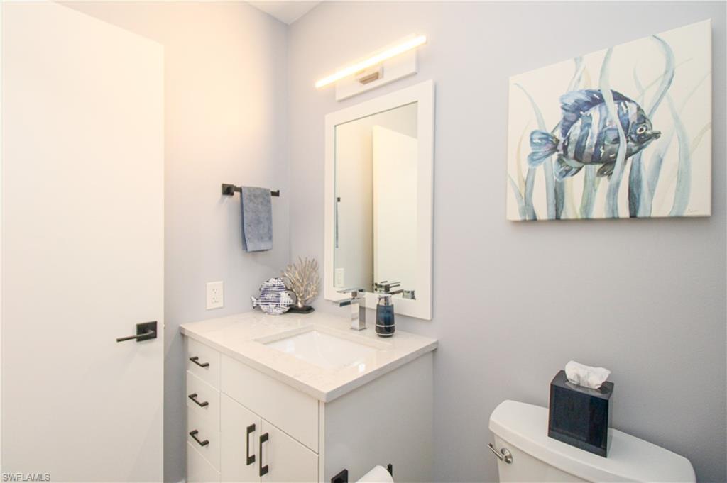 225 Robin Hood Circle, Unit 203 Naples, FL 34104 - Photo 32 of 50 Bathroom with vanity and toilet