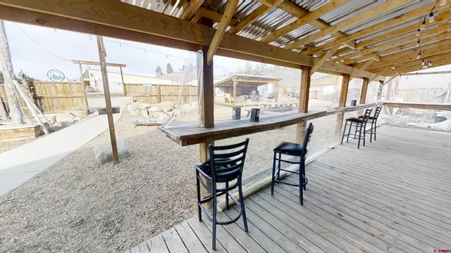 a view of a patio with wooden floor