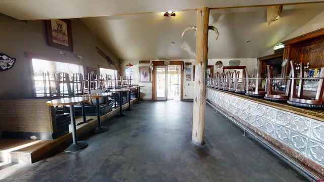 a large room with lots of wooden furniture