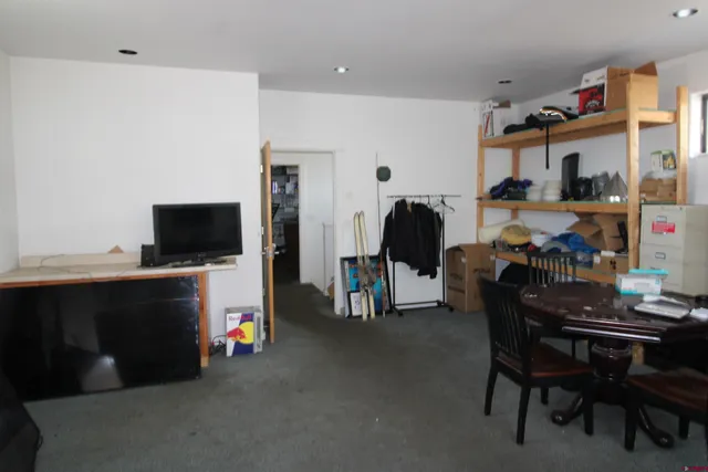 a room with furniture and gym equipment