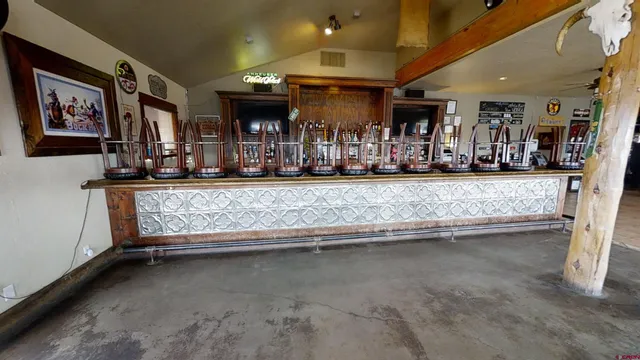 a close view of a sink and living room with furniture