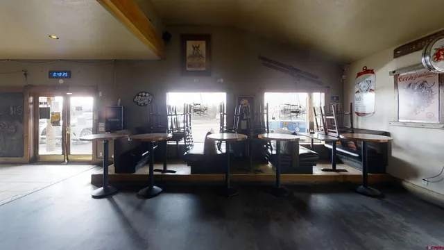 a room with lots of furniture and a chandelier