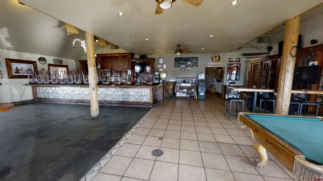 a room with lots of tables and chairs