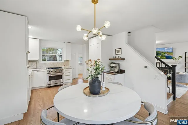 a view of a kitchen with furniture and a chandelier
