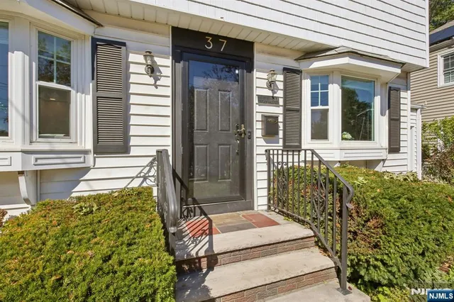 front of a house with a large window
