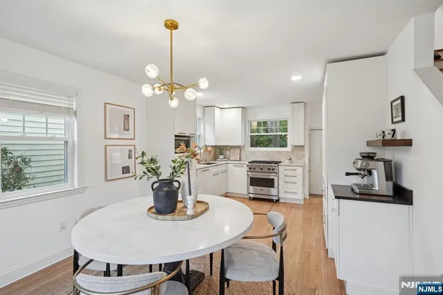 a dining room with furniture and wooden floor