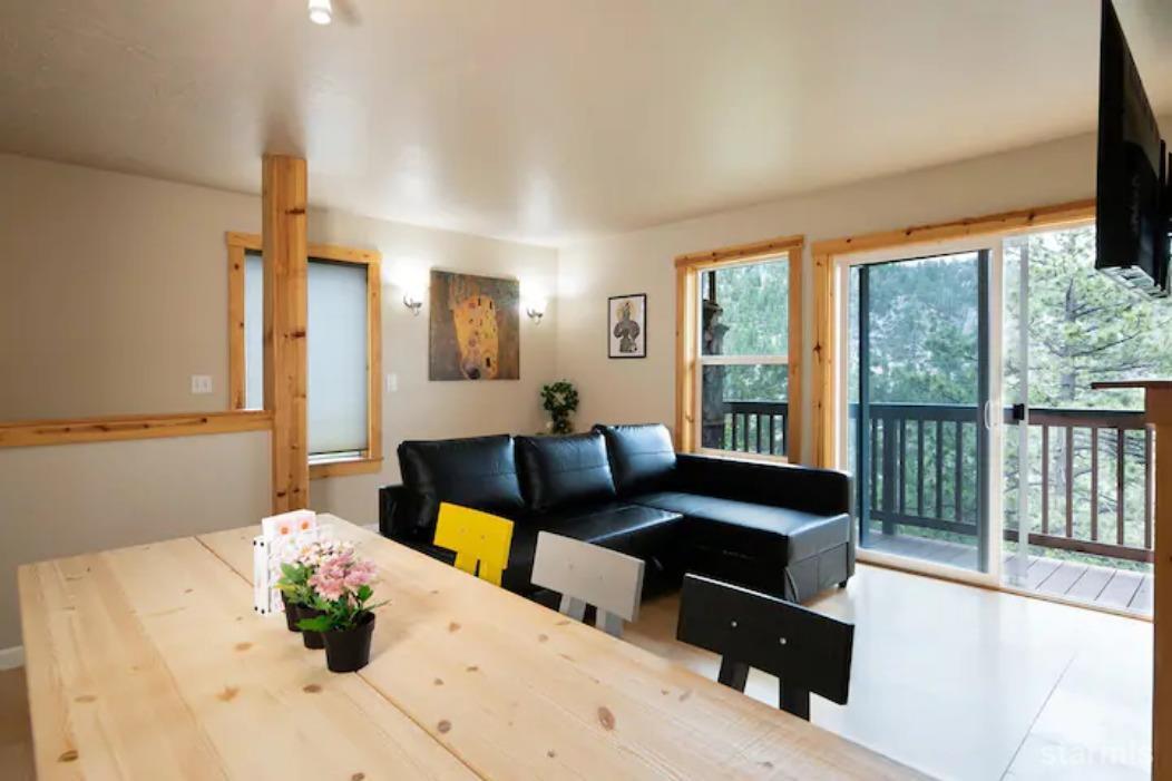 115 Tramway Drive, Unit 1 Stateline, NV 89449 - Photo 3 of 20 a living room with furniture and a large window