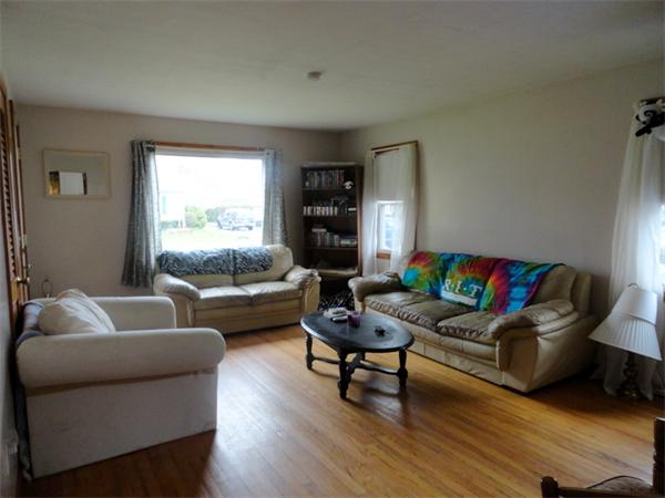 25 Canton Street Springfield, MA 01104 - Photo 3 of 24 a living room with furniture and a couch