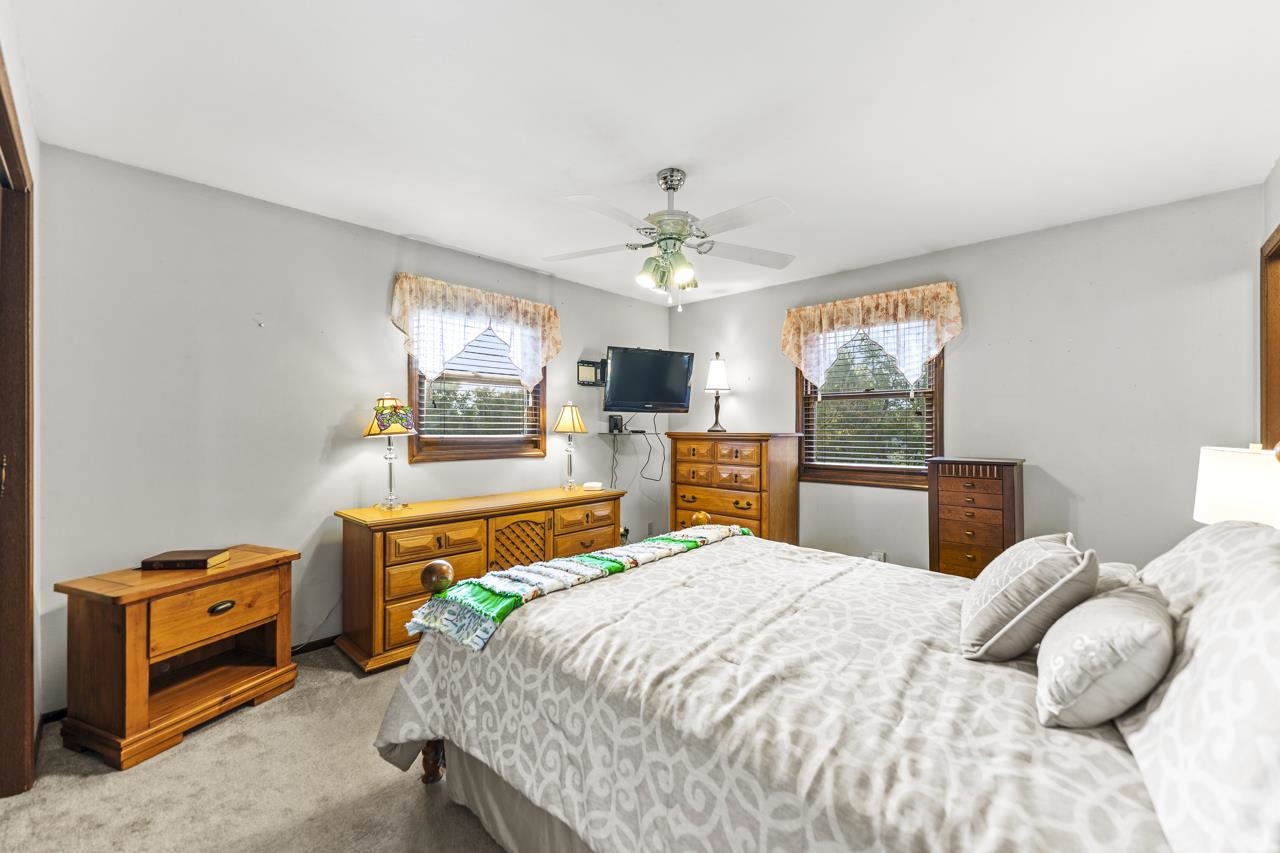 295 Forestcliff Court Lake Summerset, IL 61019 - Photo 12 of 30 a bedroom with a bed and a tv on the dresser