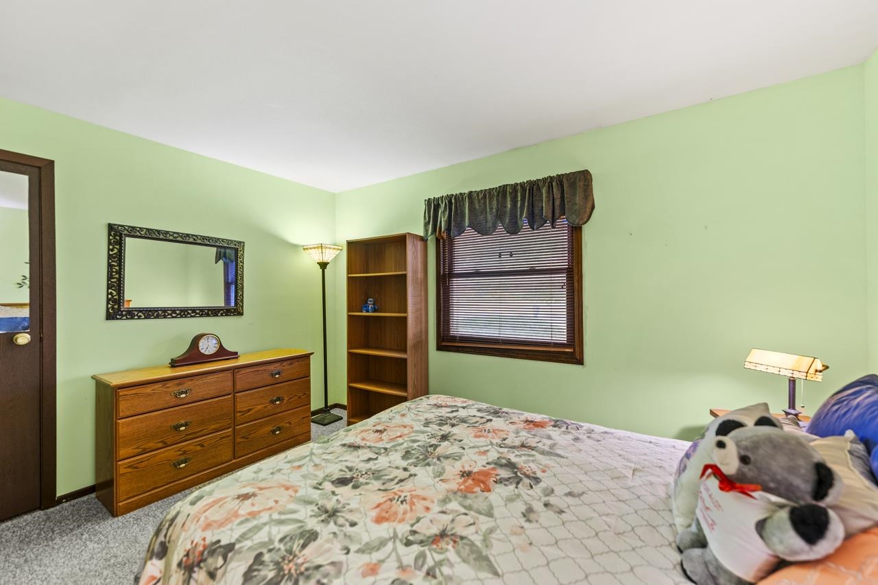 295 Forestcliff Court Lake Summerset, IL 61019 - Photo 16 of 30 a bedroom with a bed and a dresser
