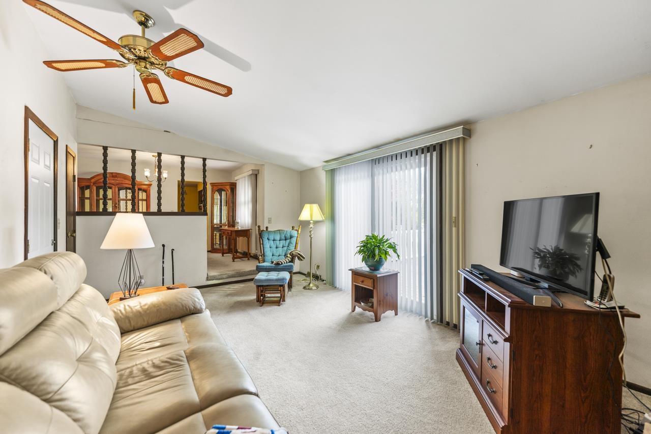 295 Forestcliff Court Lake Summerset, IL 61019 - Photo 9 of 30 a living room with furniture and a flat screen tv