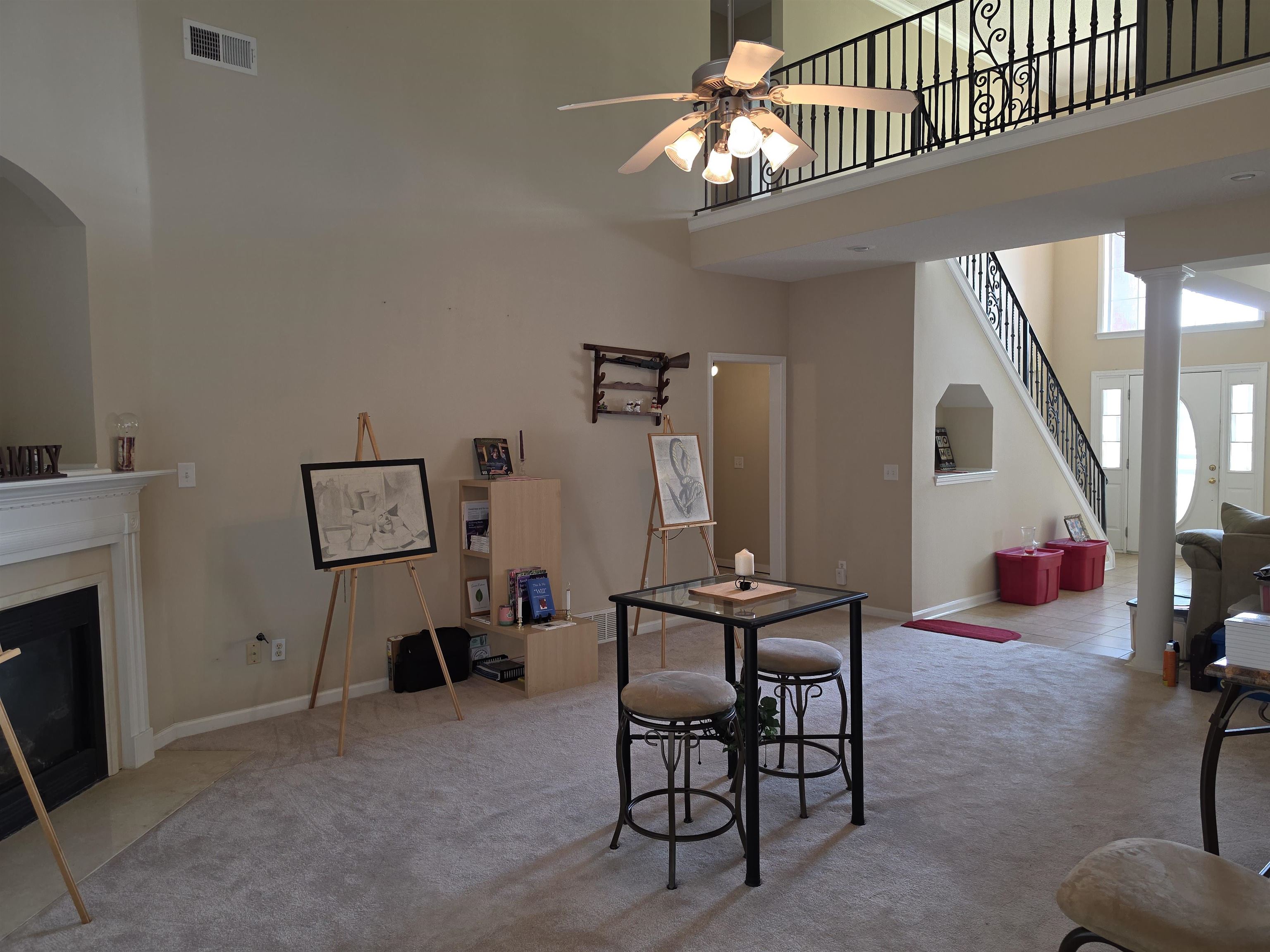 7253 Rourke Circle Memphis, TN 38125 - Photo 5 of 31 Spacious living area featuring a vaulted ceiling, a fireplace with a white mantel, and carpet flooring