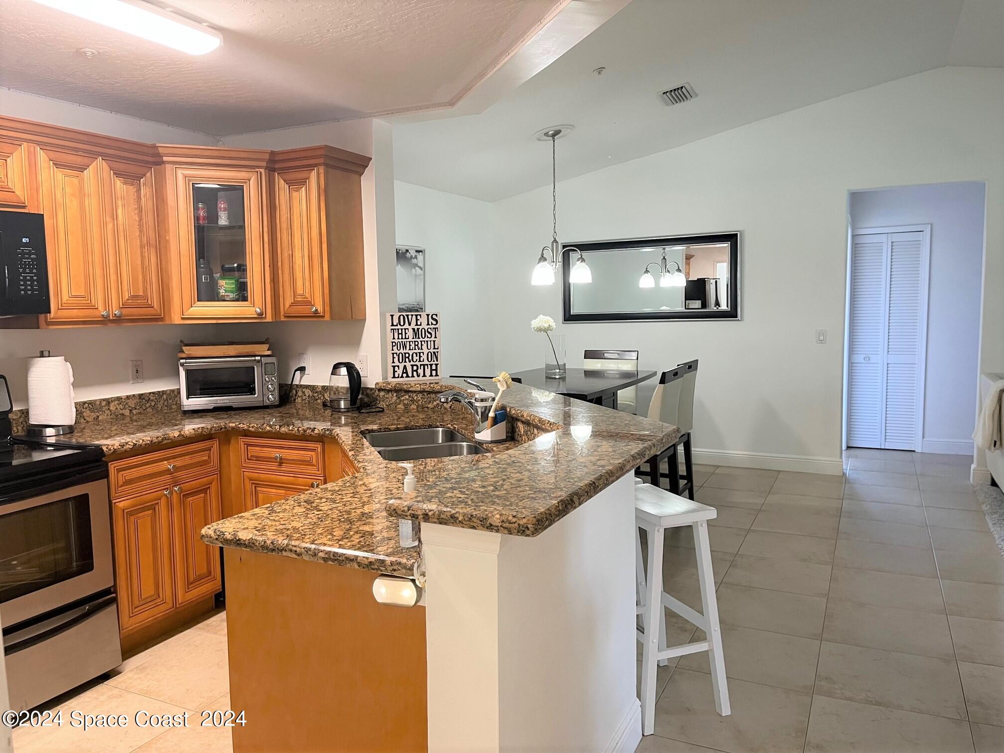 7667 North Wickham Road, Unit 1010 Melbourne, FL 32940 - Photo 6 of 25 Vaulted Ceilings
