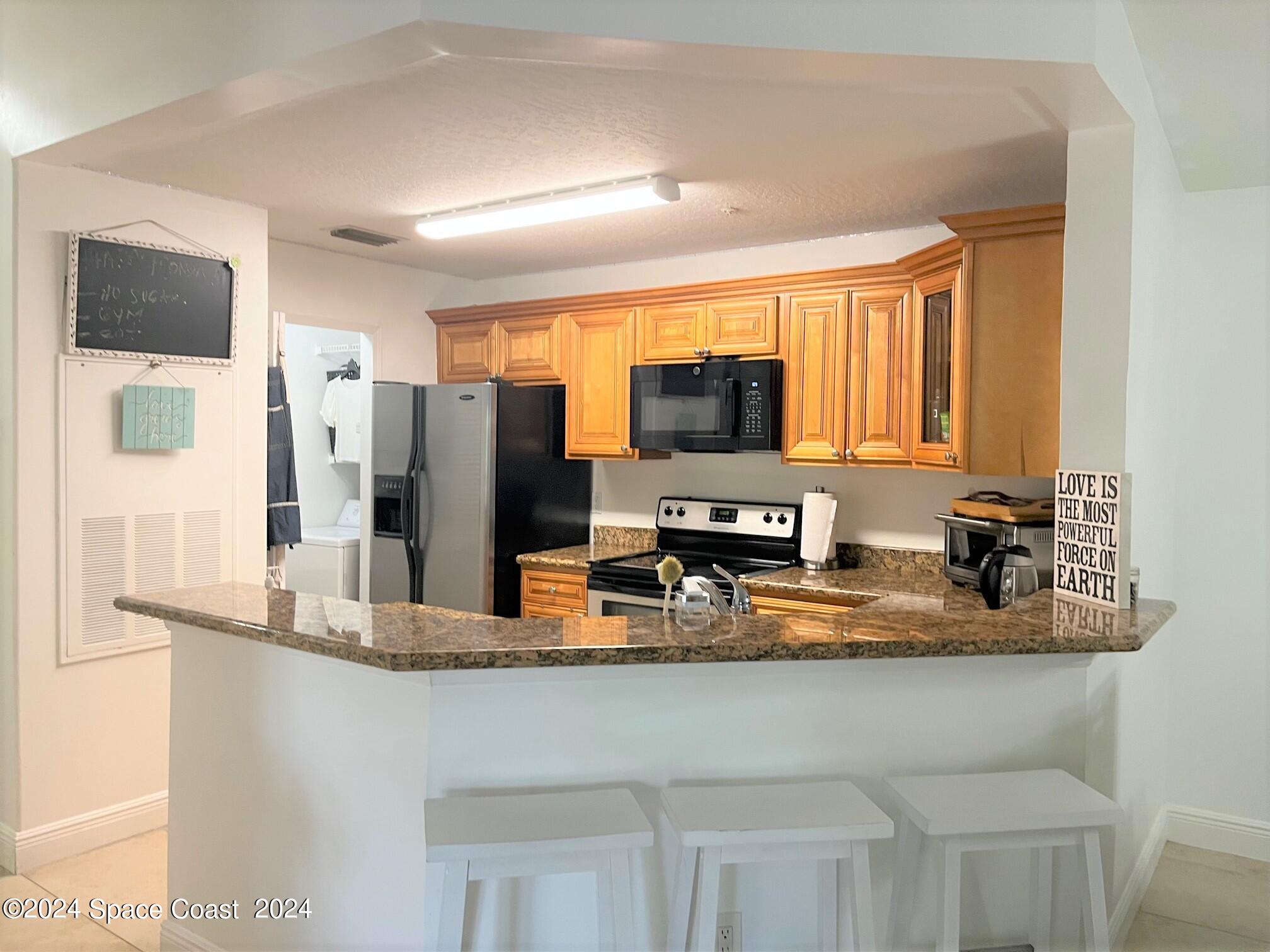 7667 North Wickham Road, Unit 1010 Melbourne, FL 32940 - Photo 8 of 25 Breakfast Bar