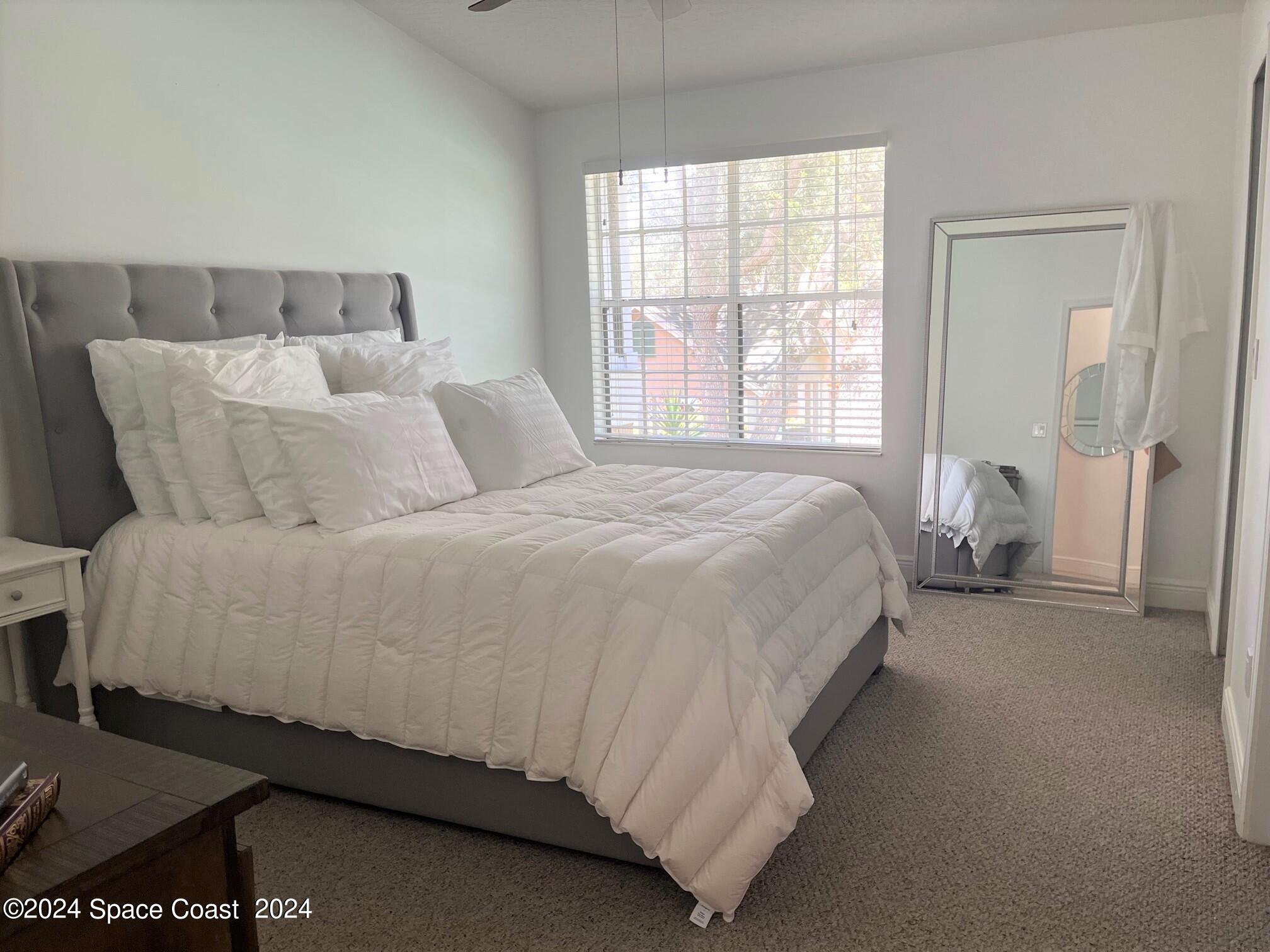 7667 North Wickham Road, Unit 1010 Melbourne, FL 32940 - Photo 9 of 25 Primary Bedroom