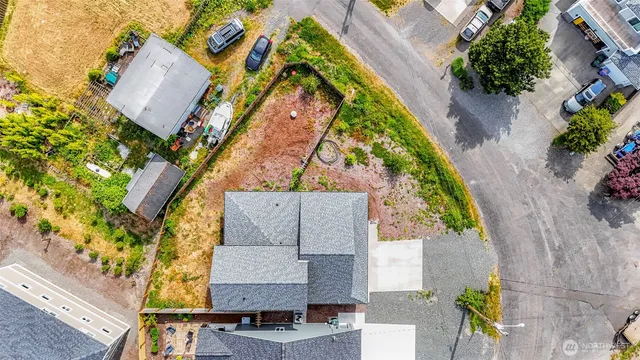 an aerial view of a house with a garden