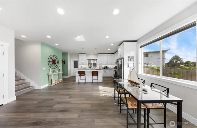 a view of a dining room with furniture window and wooden floor