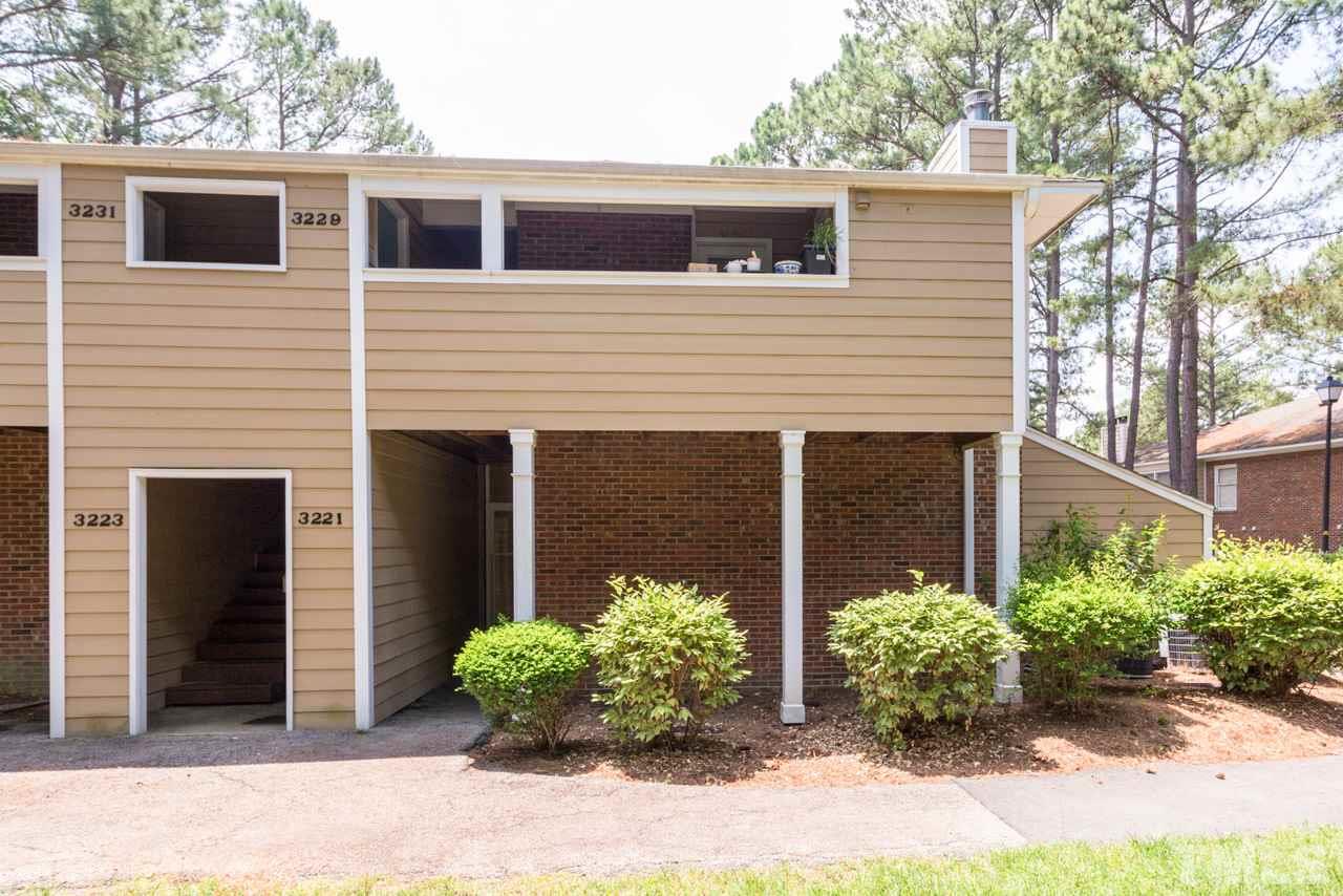 3221 Mill Run Raleigh, NC 27612 - Photo 5 of 20 a front view of a house with garden
