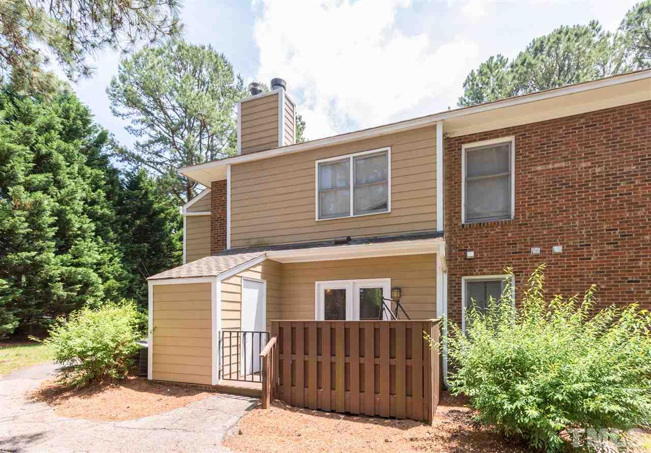 3221 Mill Run Raleigh, NC 27612 - Photo 6 of 20 a front view of a house with a garden