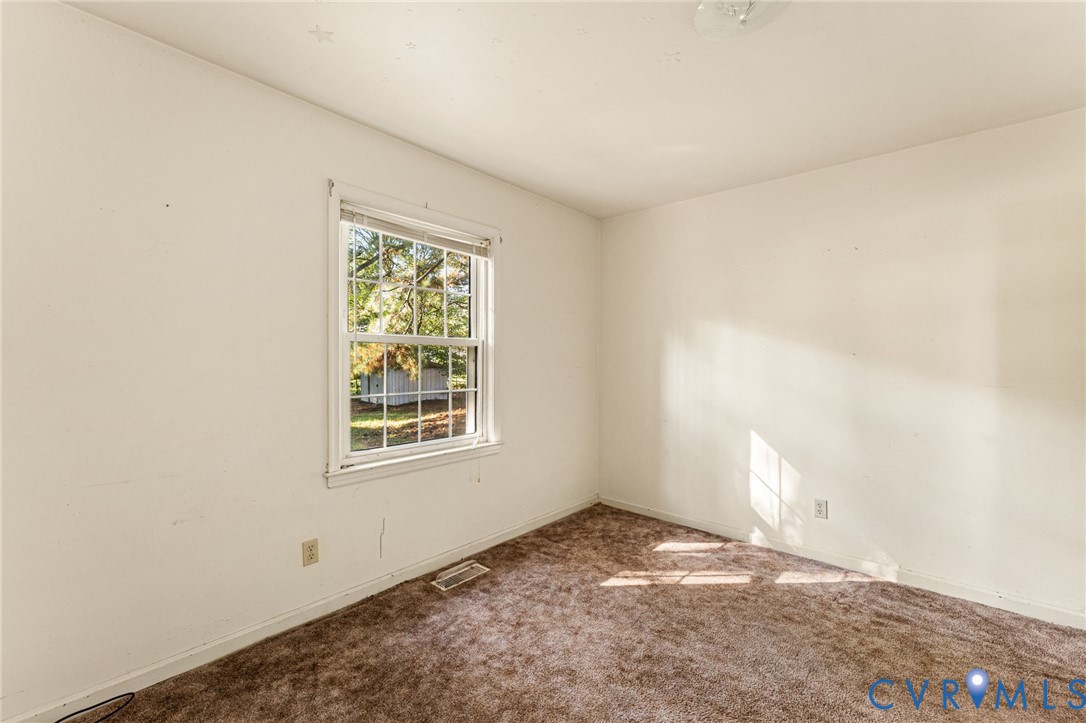 310 East Gwynnfield Road Tappahannock, VA 22560 - Photo 11 of 27 an empty room with a window