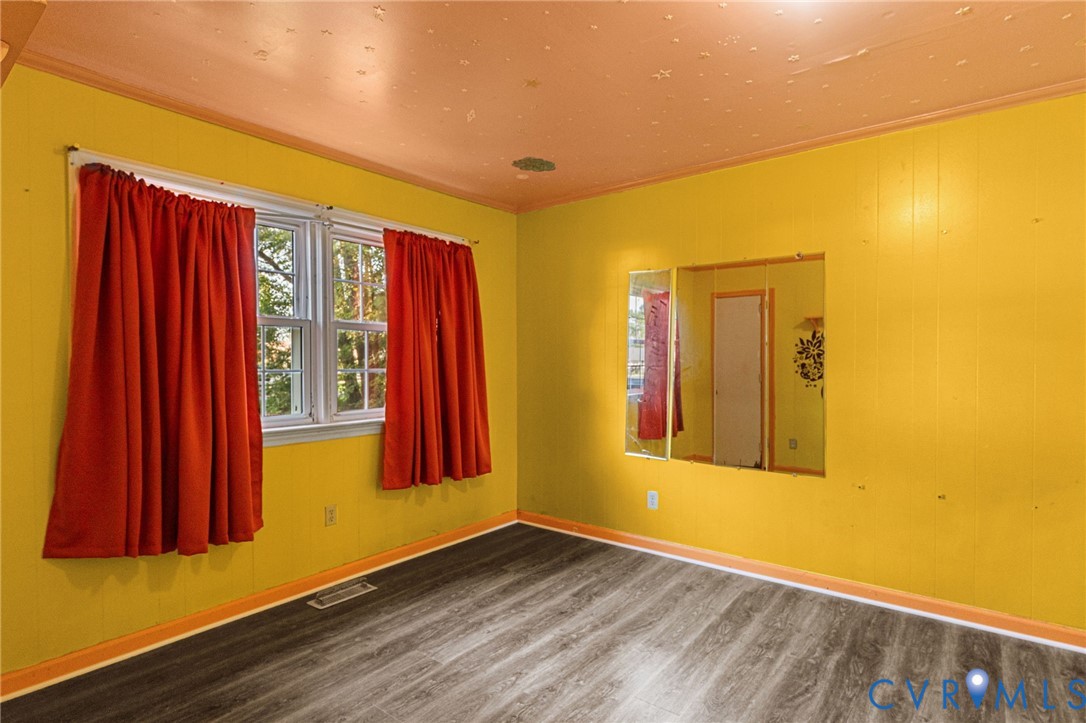 310 East Gwynnfield Road Tappahannock, VA 22560 - Photo 12 of 27 a view of a room with wooden floor and a window
