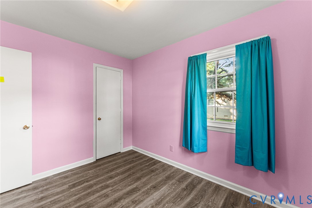 310 East Gwynnfield Road Tappahannock, VA 22560 - Photo 14 of 27 a view of an empty room with window and stairs