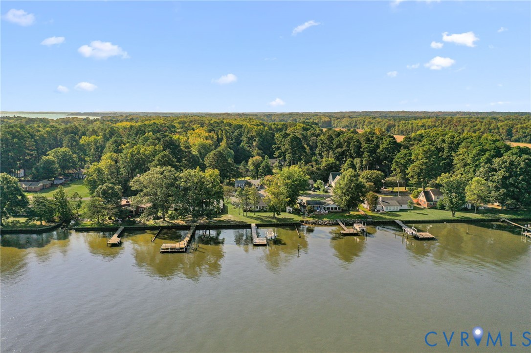 310 East Gwynnfield Road Tappahannock, VA 22560 - Photo 20 of 27 a view of swimming pool with outdoor seating and yard