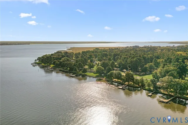 a view of a lake with houses in the back