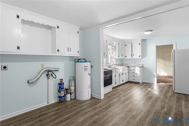 a view of storage and utility room with wooden floor