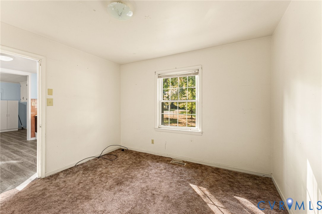 310 East Gwynnfield Road Tappahannock, VA 22560 - Photo 10 of 27 an empty room with a window