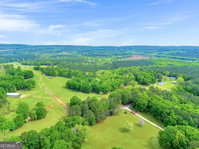 a view of a green field with clear sky