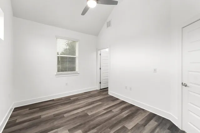 a bedroom with bed and window