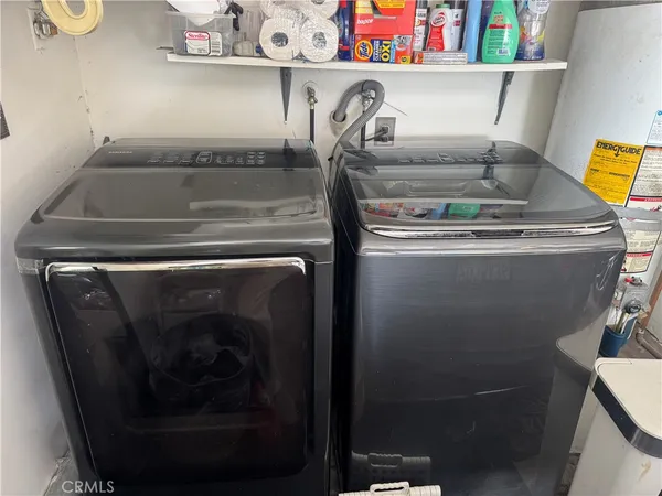 a close view of laundry room with a washer and dryer