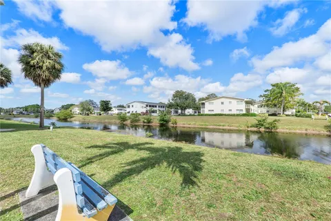 a view of a lake with a building in the background