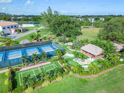 an aerial view of a house with garden space and street view