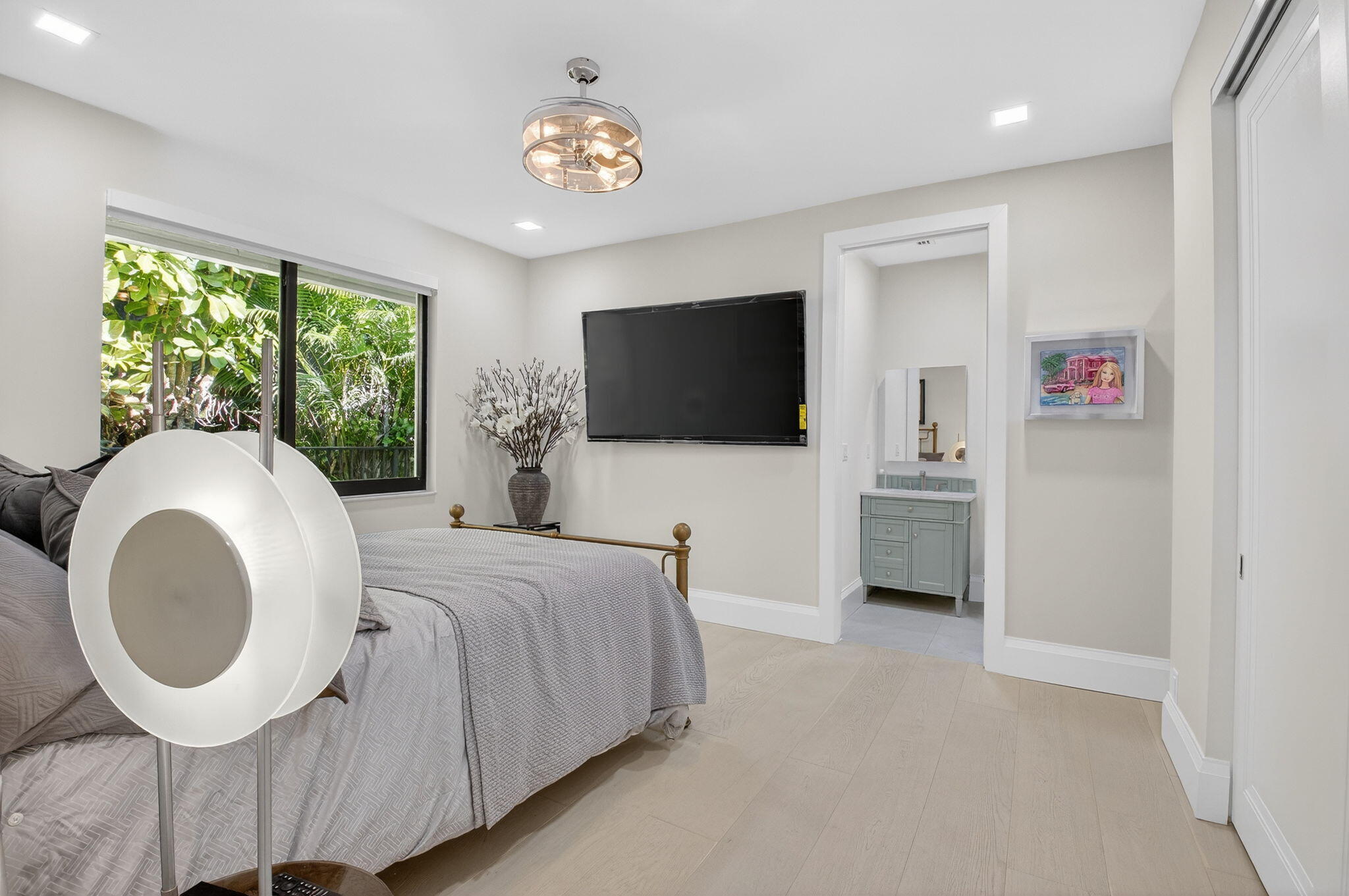 5723 Hamilton Way Boca Raton, FL 33496 - Photo 37 of 111 a spacious bedroom with a bed and a flat screen tv