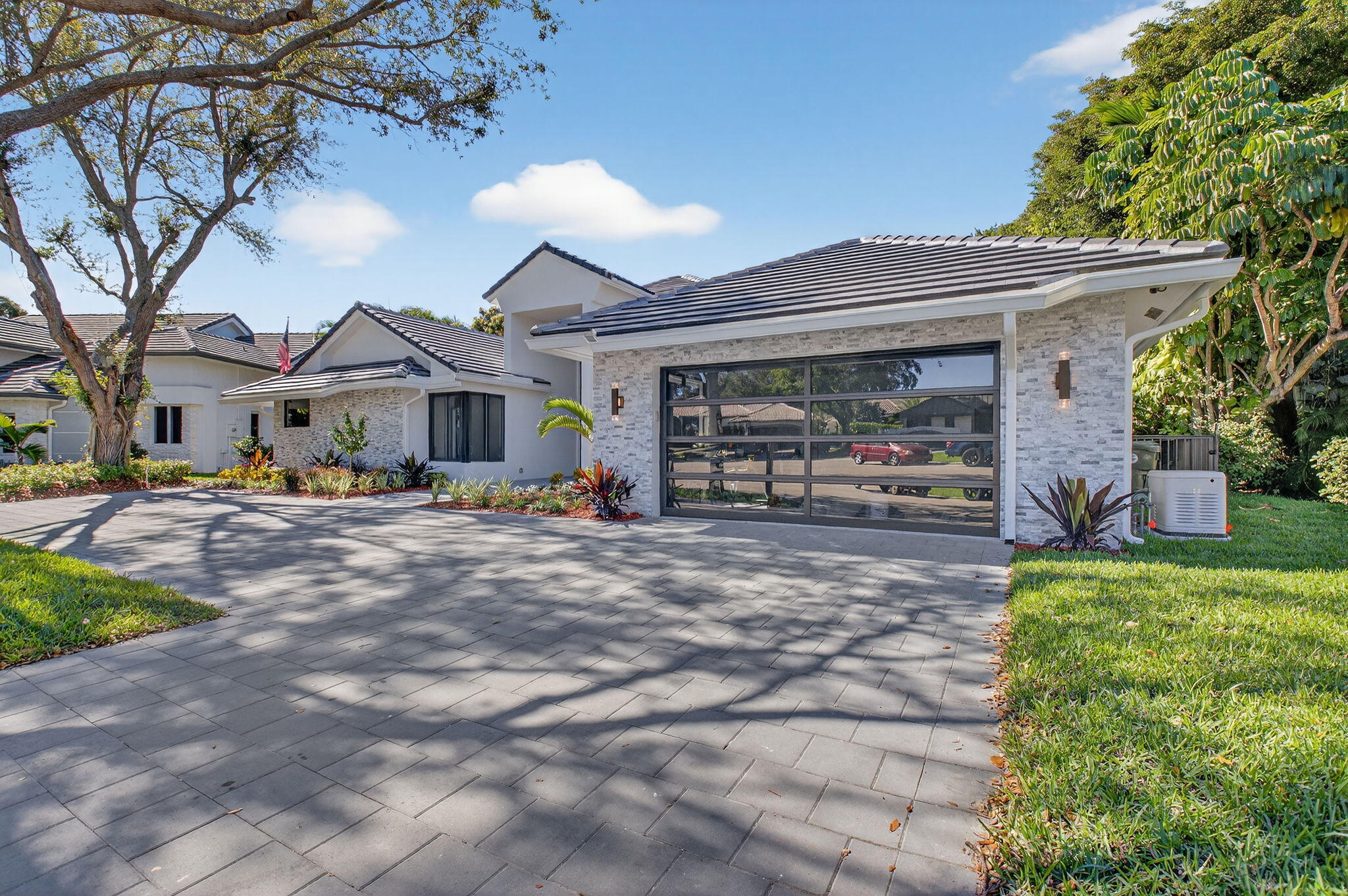 5723 Hamilton Way Boca Raton, FL 33496 - Photo 4 of 111 a front view of a house with a yard and potted plants