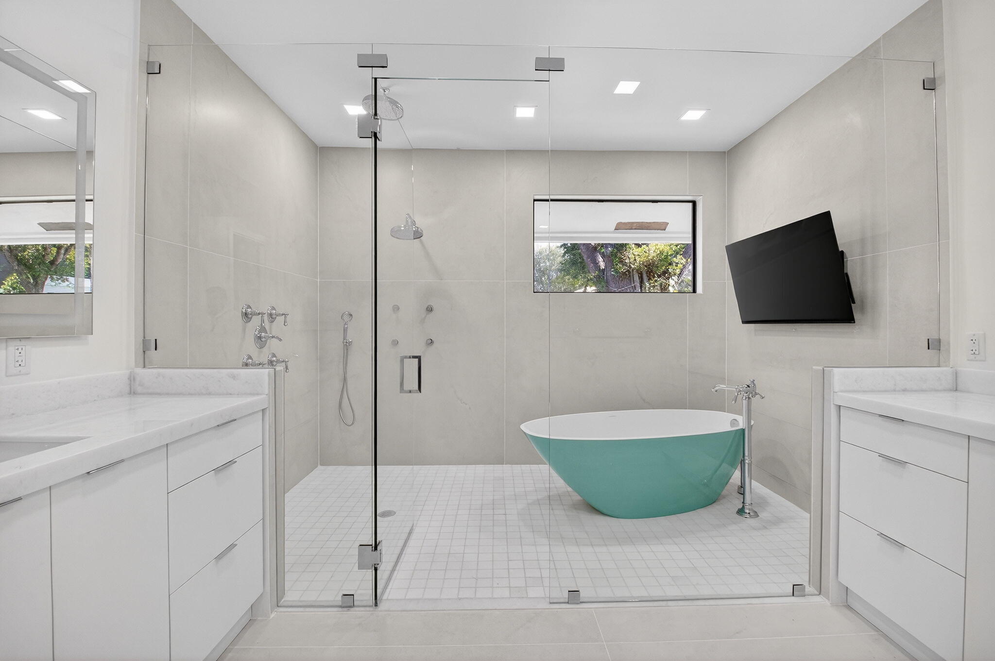 5723 Hamilton Way Boca Raton, FL 33496 - Photo 42 of 111 a spacious bathroom with a granite countertop sink a mirror a vanity and a shower