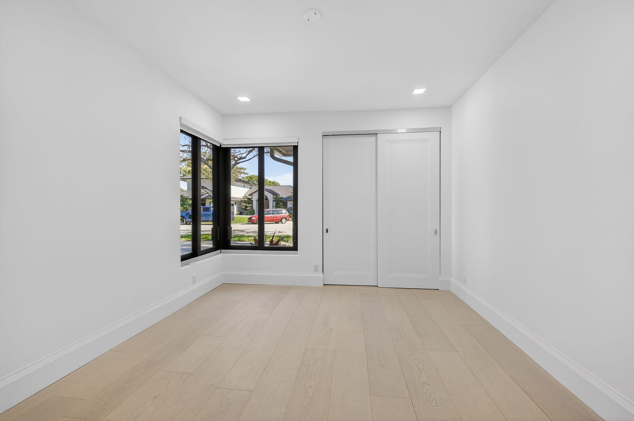 5723 Hamilton Way Boca Raton, FL 33496 - Photo 51 of 111 wooden floor in an empty room with a window