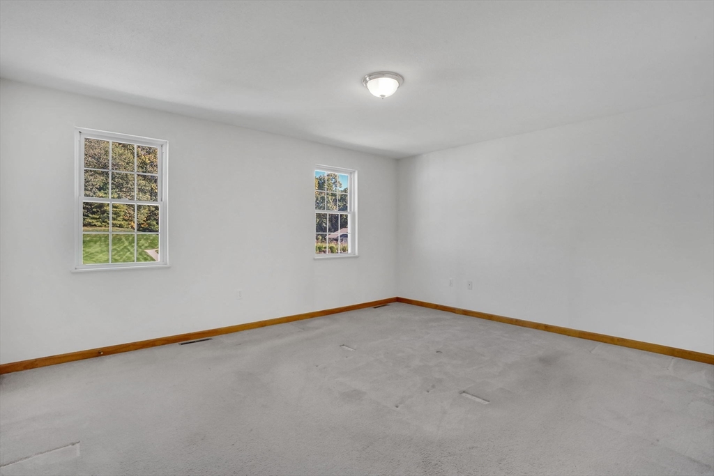 665 Center Street, Unit 705 Ludlow, MA 01056 - Photo 18 of 35 an empty room with a empty space and a window