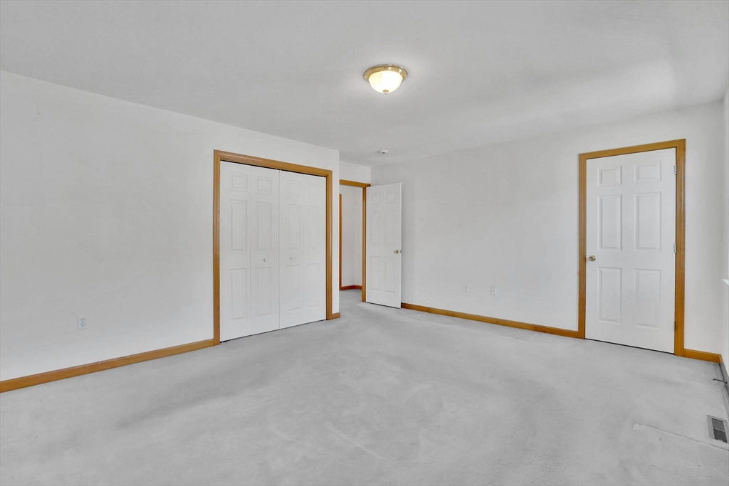 665 Center Street, Unit 705 Ludlow, MA 01056 - Photo 19 of 35 a view of an empty room and a window
