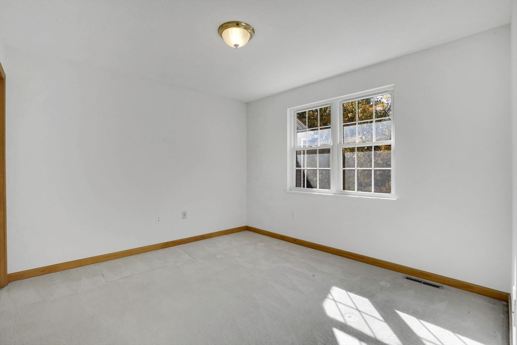 665 Center Street, Unit 705 Ludlow, MA 01056 - Photo 21 of 35 a view of an empty room with a window