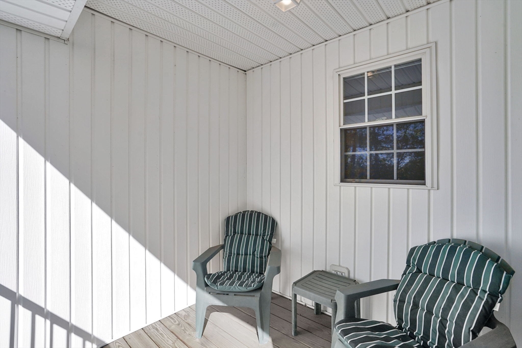 665 Center Street, Unit 705 Ludlow, MA 01056 - Photo 23 of 35 a view of a chair and table in the balcony