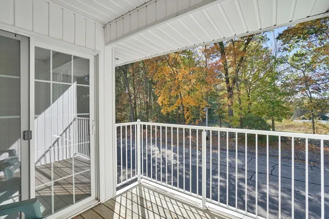 a white toilet sitting next to a white sink
