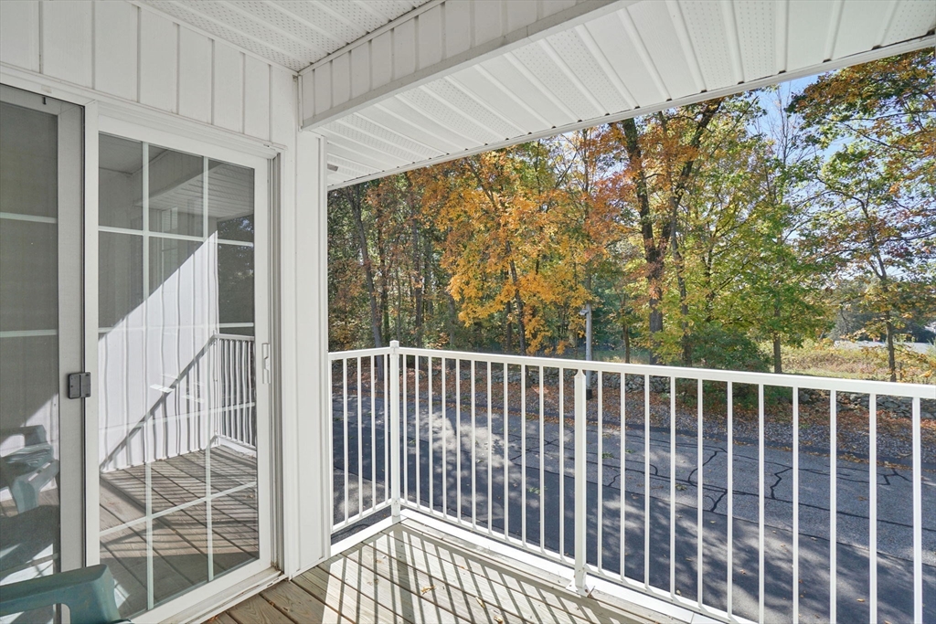 665 Center Street, Unit 705 Ludlow, MA 01056 - Photo 24 of 35 a view of outdoor space with wooden fence