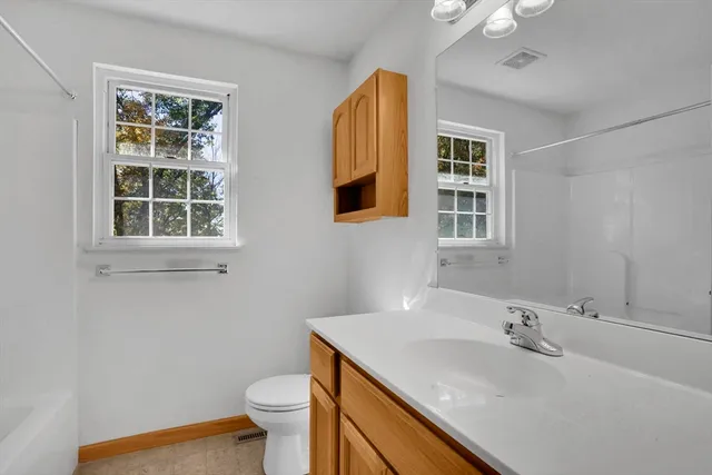 a view of empty room with windows